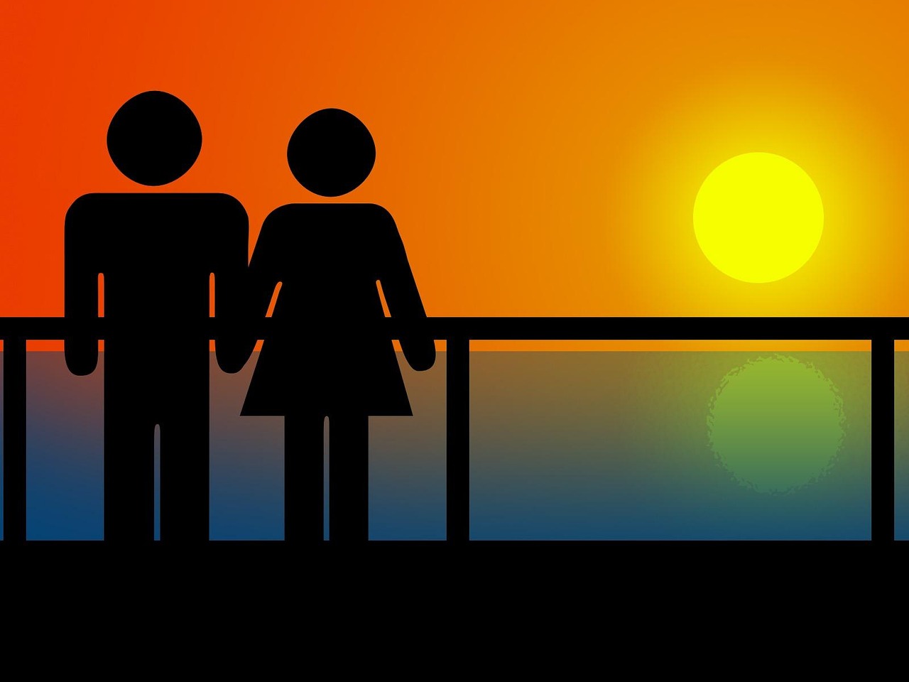 Silueta de pareja frente al mar al atardecer